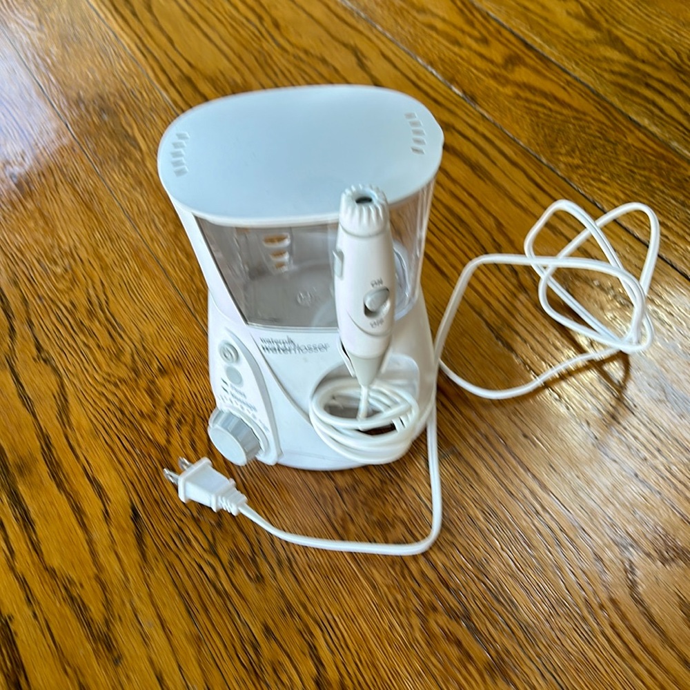 Waterpik brand water flosser. Used but great condition.  No personal attachments
